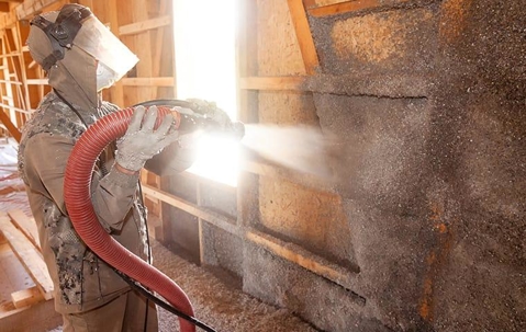 Applying spray foam insulation in a home