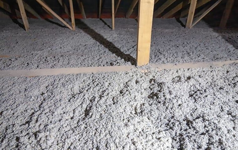 spraying insulation in a attic